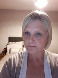 Close-up portrait of a young woman at home