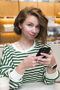 Young woman using mobile phone