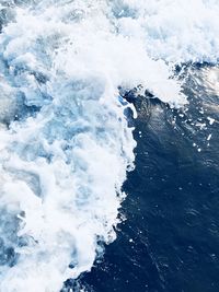 High angle view of waves splashing in sea