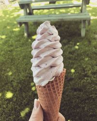 Hand holding ice cream cone