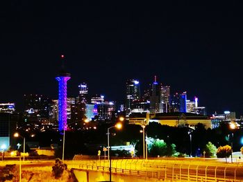 Illuminated city buildings at night