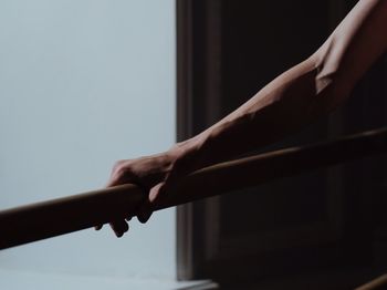 Low angle view of woman standing against wall