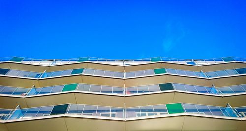 Low angle view of building against clear blue sky