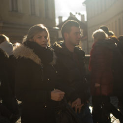 Woman standing on street in city