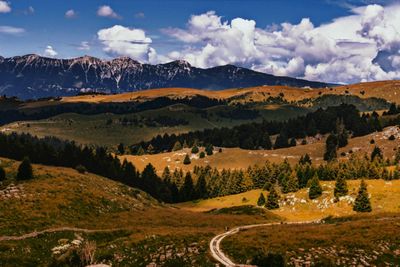 Scenic view of landscape and mountains against sky