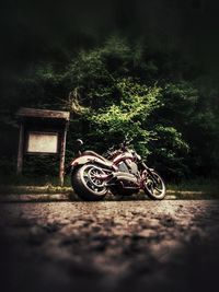 Bicycle parked outside house on field