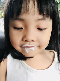 Close-up portrait of a smiling girl