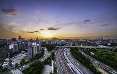 Cityscape against sky during sunset