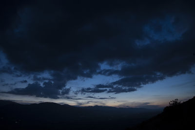 Scenic view of dramatic sky at sunset