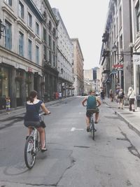 Full length of woman walking on road in city