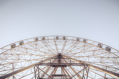 Low angle view of ferris wheel against clear sky