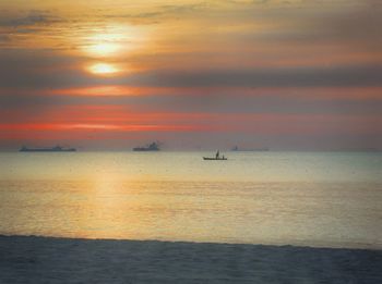 Scenic view of sea at sunset