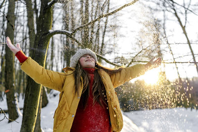 Woman standing in snow