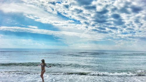 Scenic view of sea against cloudy sky