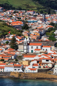 High angle view of houses and buildings in town