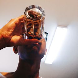 Cropped image of hand holding glass