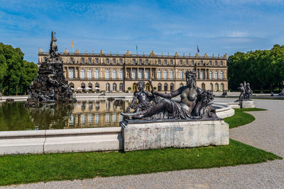 Statue at fountain with castle in background