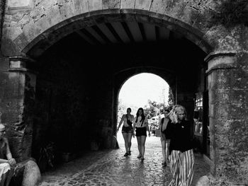 People walking in old building