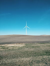 Wind turbines in field