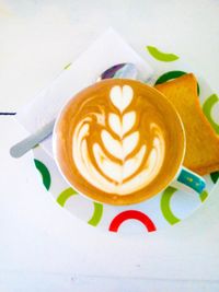 Close-up of cappuccino on table