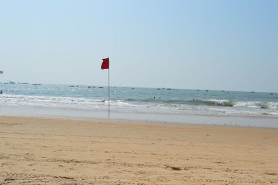 Scenic view of beach against clear sky