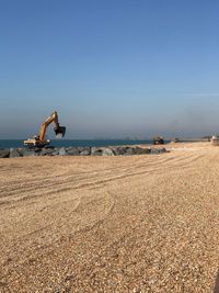 Scenic view of beach against clear sky