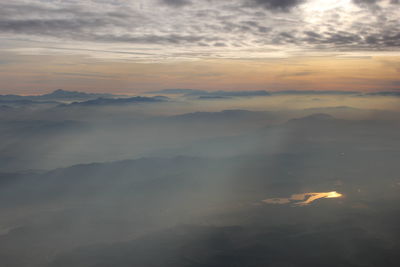 Scenic view of sea against sky during foggy weather