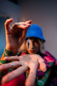 Cropped hand of woman holding water