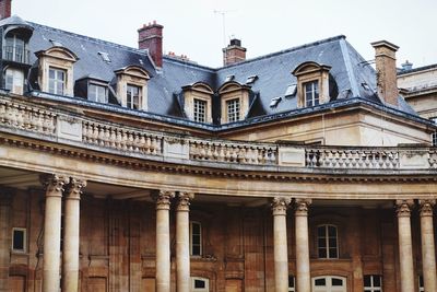 Low angle view of archives nationales at hotel de soubise against sky