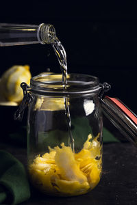 Close-up of drink in glass jar on table