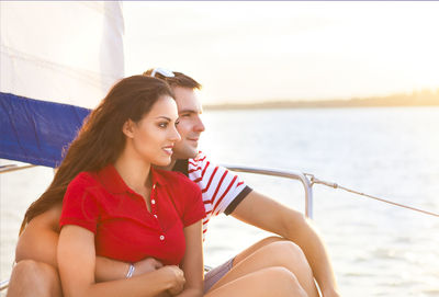 Young couple sitting in boat