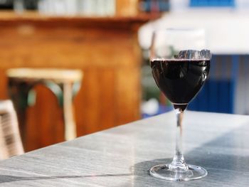 Close-up of wine in glass on table