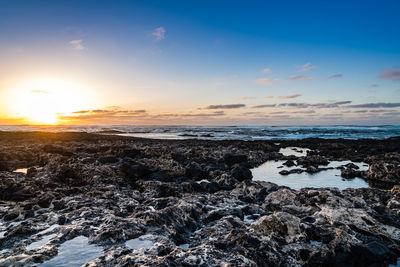 Scenic view of sea against sky during sunset