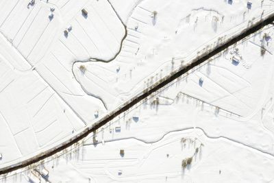 Aerial view straught down at a snowy landscape in ehrwald austria