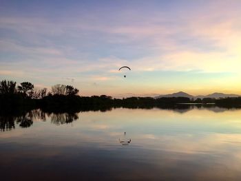 Scenic view of lake against sky during sunset