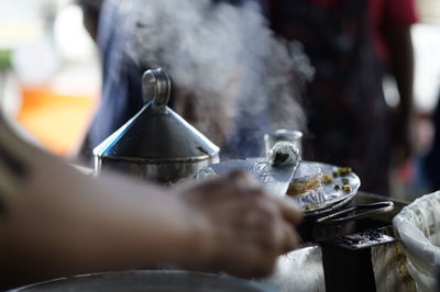 Cropped image of man working at food stall