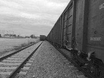 Train on railroad tracks against sky