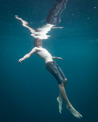 Woman swimming in sea