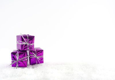 Close-up of christmas decorations over white background