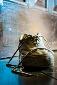 Close-up of shoes on table