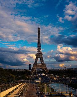 Communications tower against cloudy sky