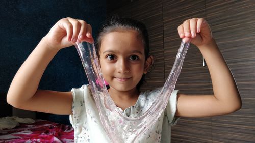 Portrait of cute girl holding hands