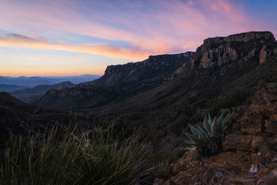 Scenic view of rocky mountains against sky during sunset