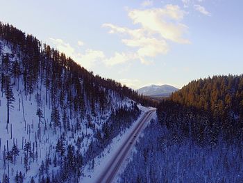 Scenic view of snow covered mountains against sky