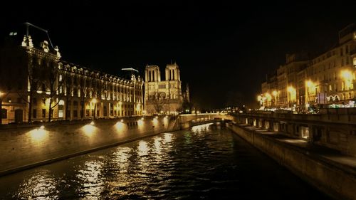 Reflection of illuminated buildings in water at night