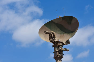 Low angle view of telephone pole against sky