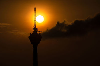 Silhouette street light against sky during sunset