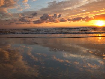 Scenic view of sea against sky at sunset