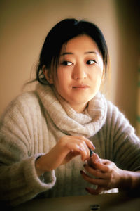 Portrait of a smiling girl sitting at home