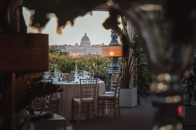 Chairs and table at cafe in city